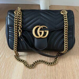 BlackGucci GG Marmont quilted black leather flap bag Gucci Marmont flap bag